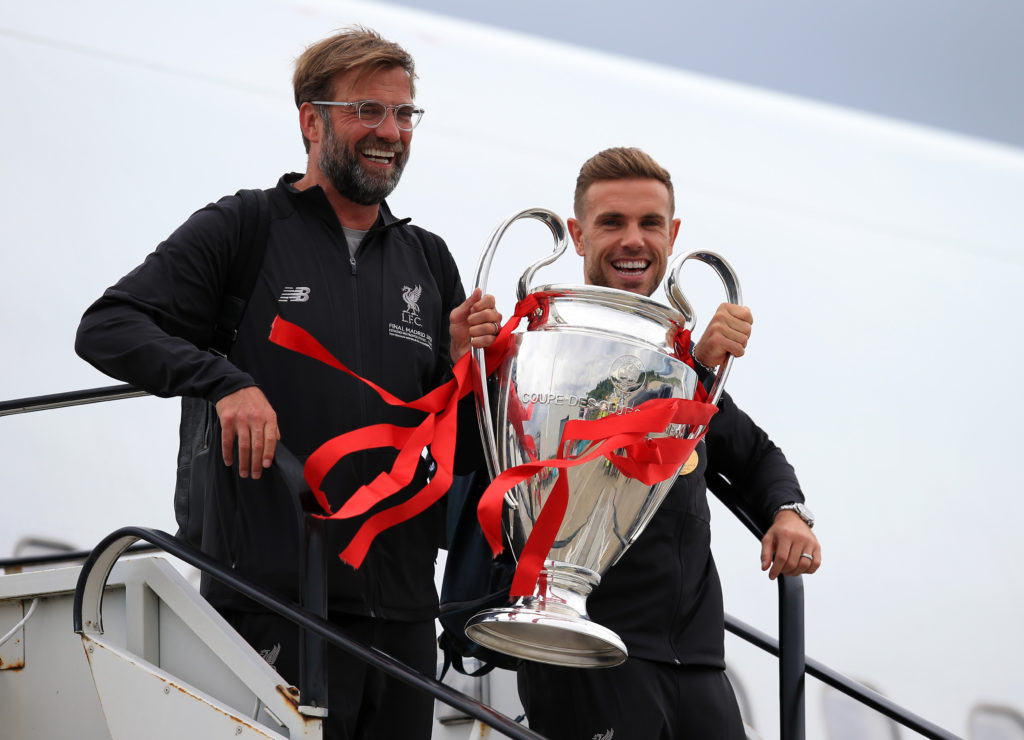 Jurgen Klopp and Jordan Henderson.