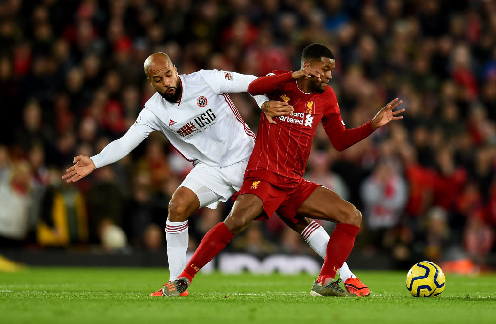 Gini Wijnladum battles Sheffield Uniteds David McGoldrick