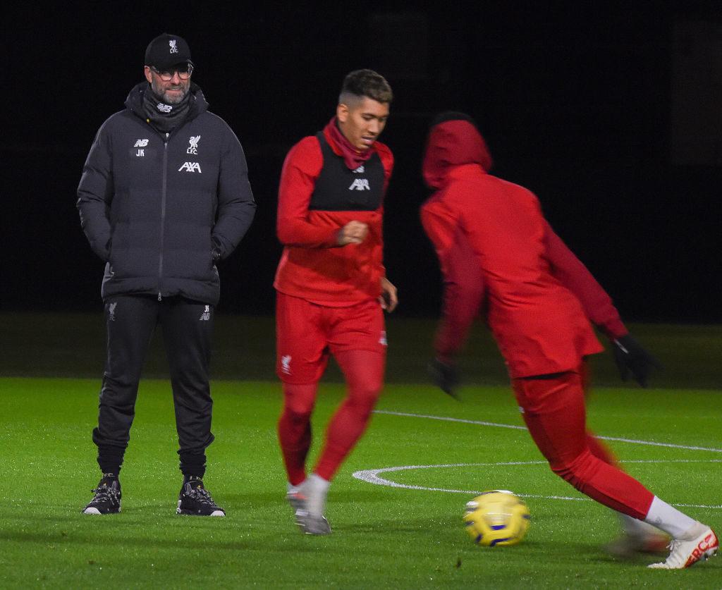 Jurgen Klopp watches Liverpool training.
