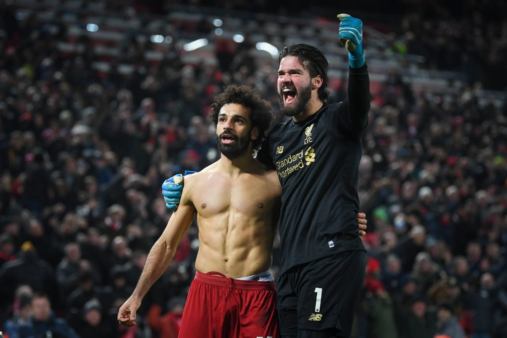 Mohamed Salah and Alisson Becker celebrate Liverpools second.