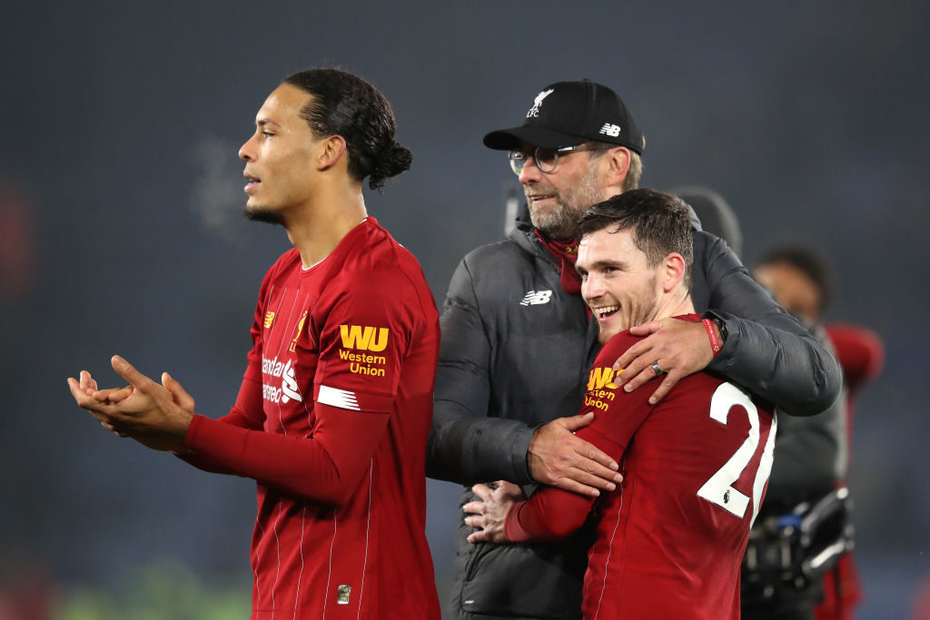 Jurgen Klopp hugs Andy Robertson.