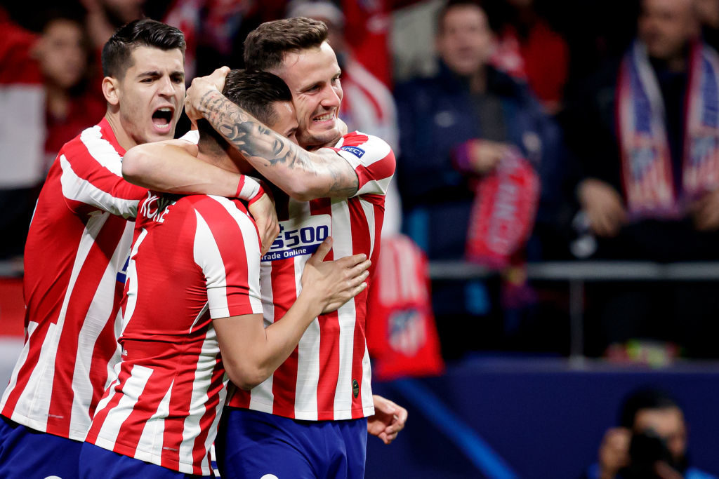 Atletico Madrid celebrate their early goal against Liverpool.