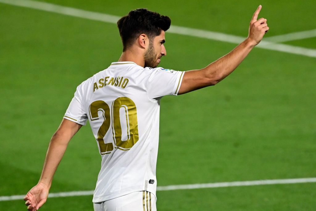 Marco Asensio celebrates scoring against Valencia.