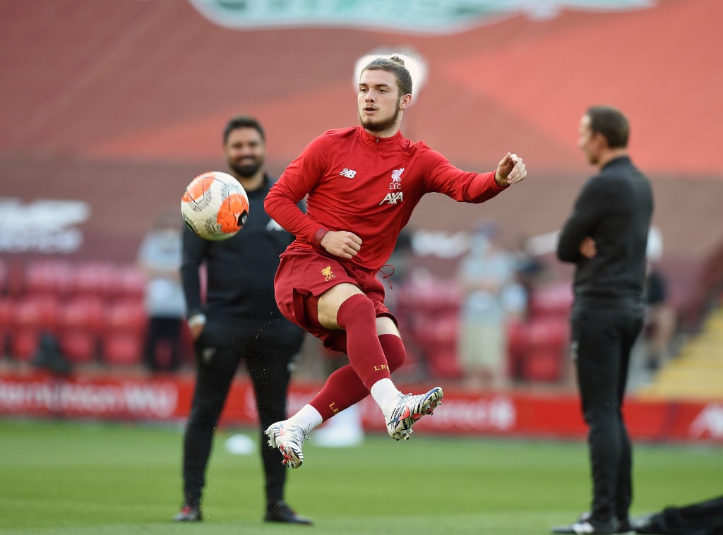 Harvey Elliott warms up for Liverpool before Crystal Palace.