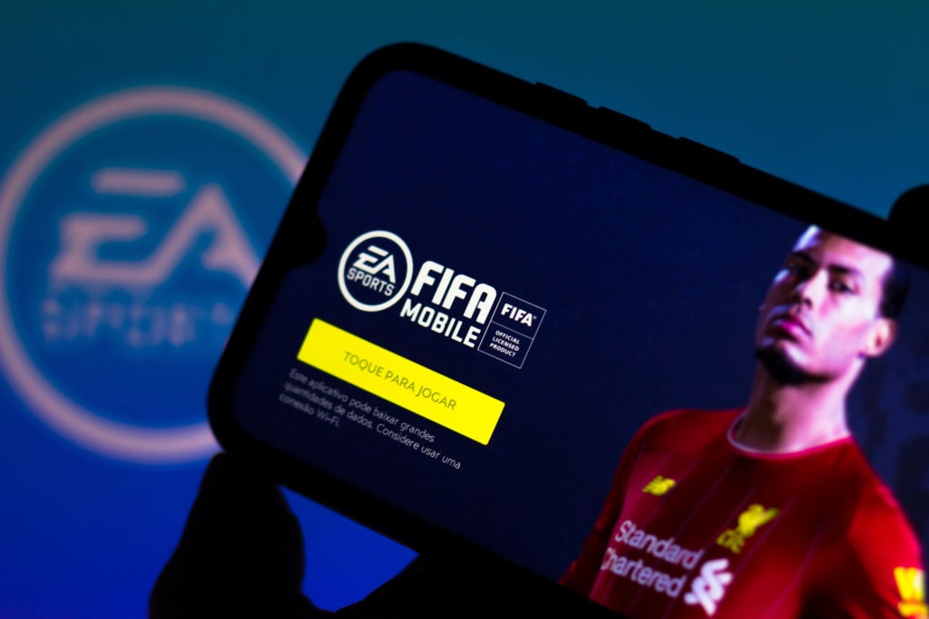 In this photo illustration the FIFA 21 logo is displayed on...