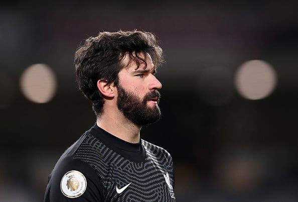 Emile Heskey believes Alisson Becker needs competition for his place.
