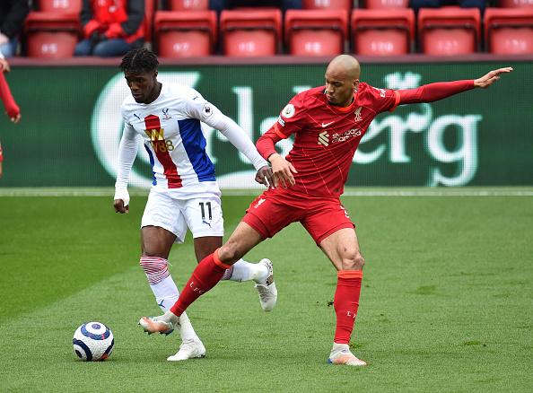 Liverpool v Crystal Palace - Fabinho tackles Wilfried Zaha