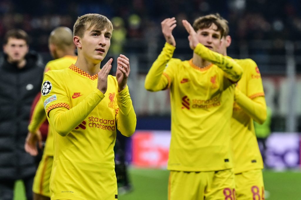 Liverpool's British midfielder Max Woltman (L) and Liverpool's British midfielder Tyler Morton (R) acknowledge the public at the end of the UEFA Champions League