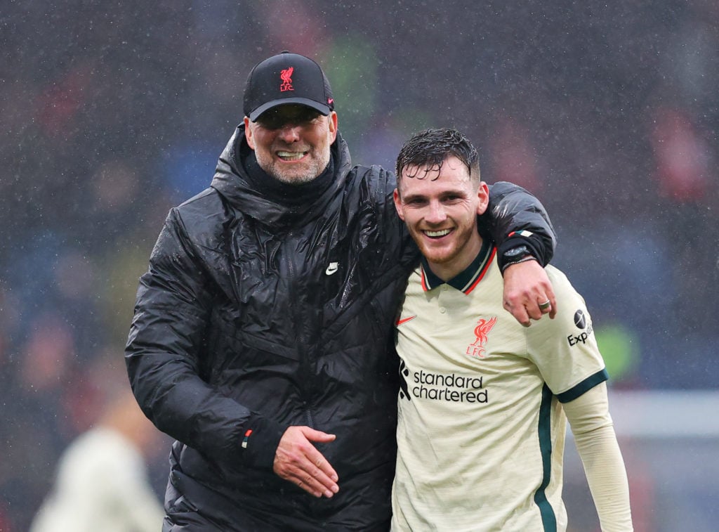 Jurgen Klopp puts his arm around Andy Robertson after Liverpool against Burnley at Turf Moor.