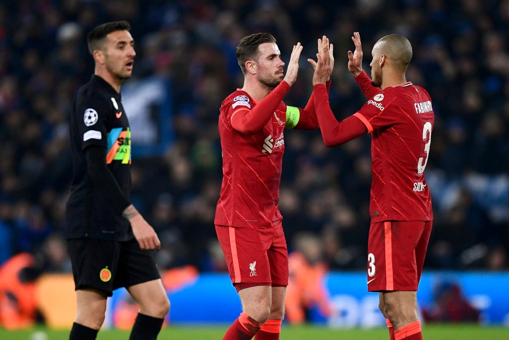 Jordan Henderson (C) of Liverpool FC celebrates with Fabio