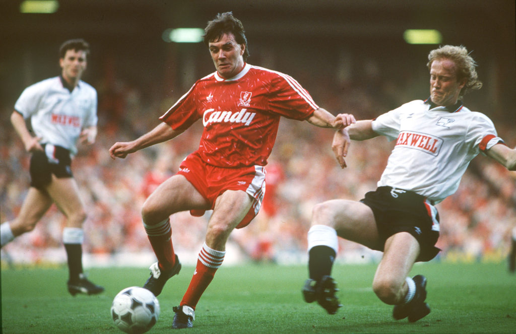 Sport. Football. pic: 1st May 1990. Division 1. Liverpool 1. v Derby County 0. Liverpool's Ray Houghton under pressure from Derby County defender Mark Wright.
