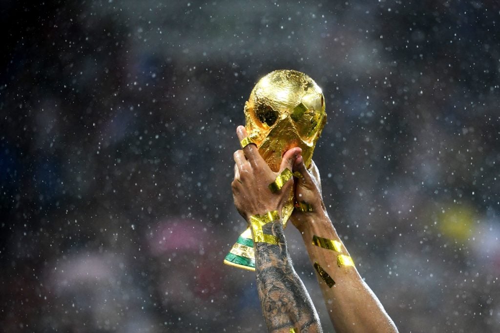 A picture of the 2018 World Cup trophy being lifted.