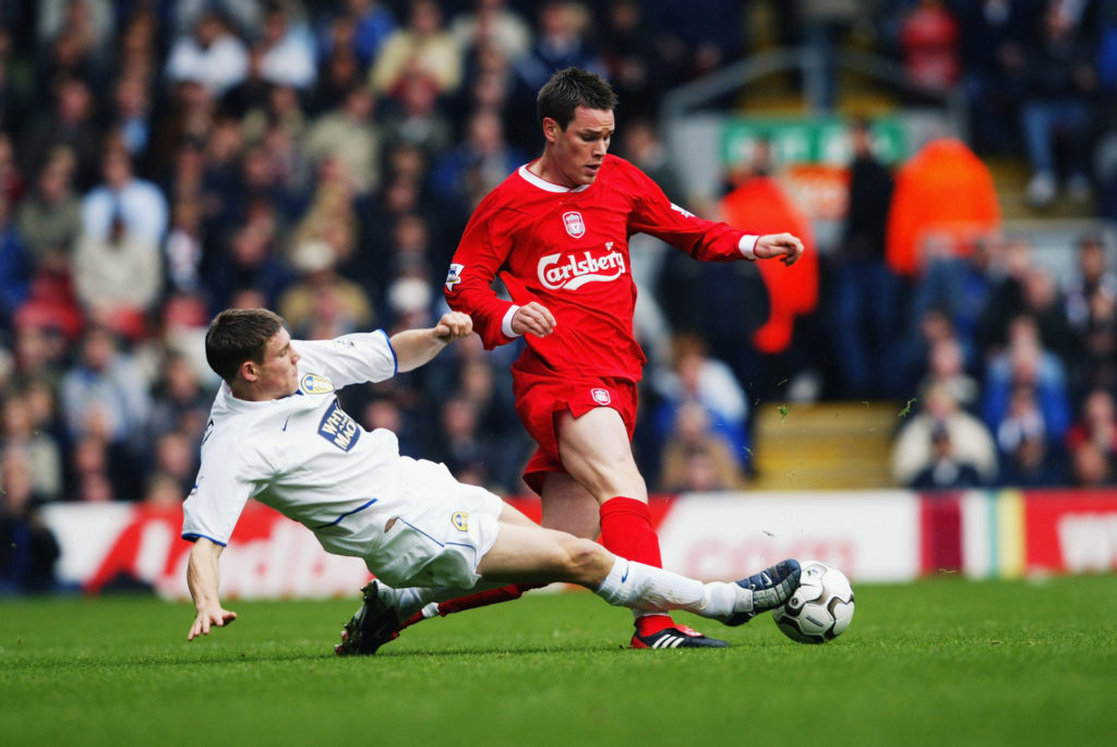 James Milner of Leeds United tackles Steve Finnan of Liverpool