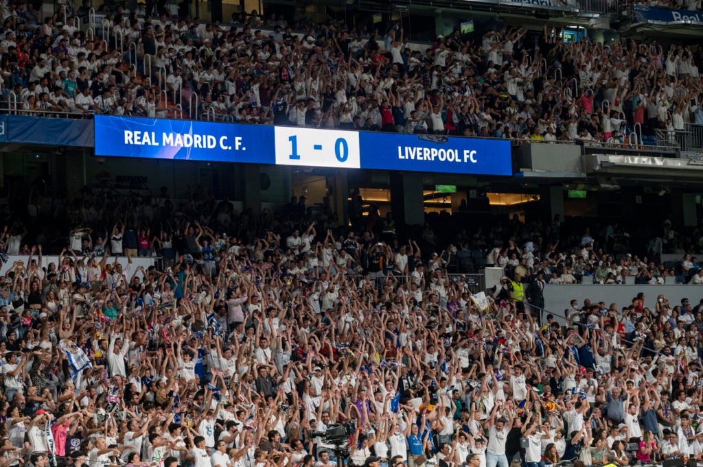 Real Madrid fans celebrate a goal as they watch live on