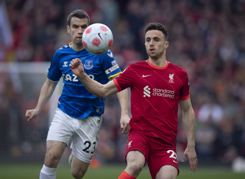 Everton captain Seamus Coleman and Liverpool's Diogo Jota battle for the ball during the Merseyside Derby at Anfield