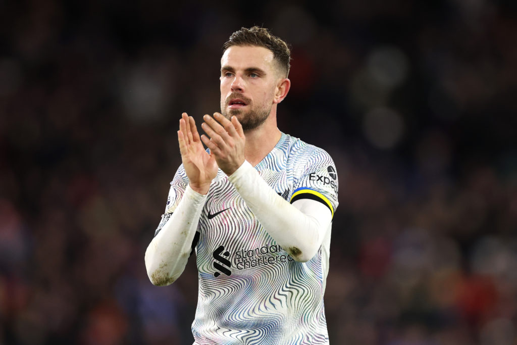 Jordan Henderson pictured playing for Liverpool in a Premier League game.