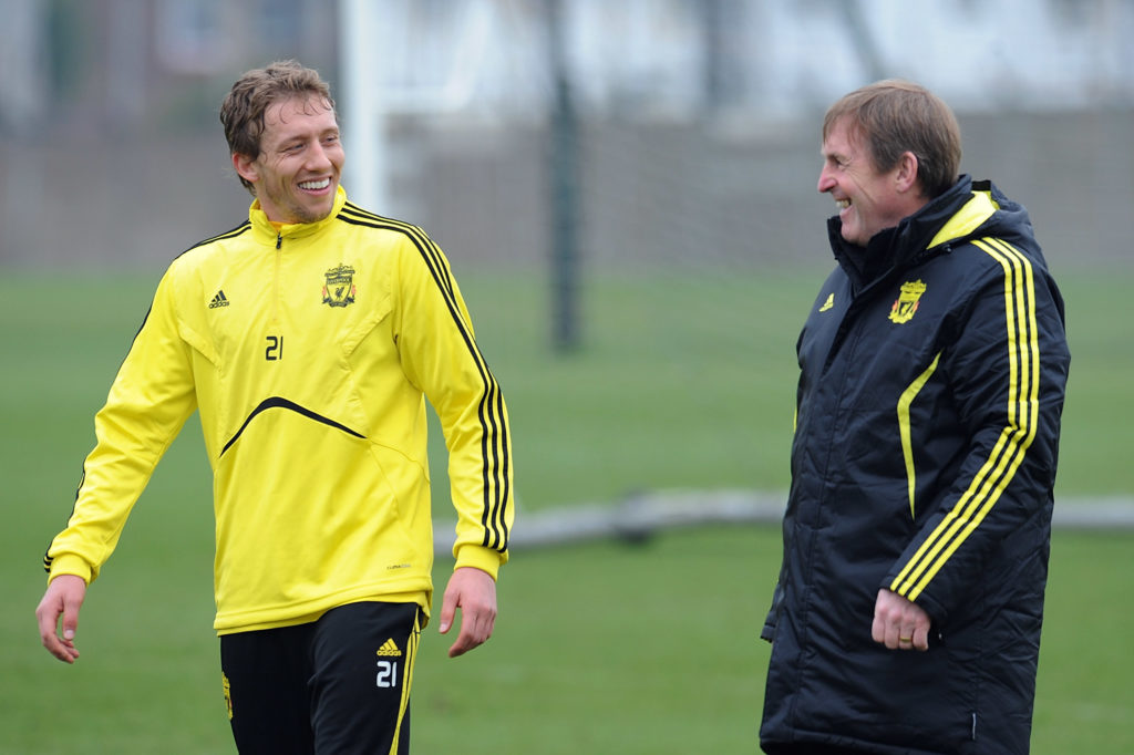 Manager Kenny Dalglish of Liverpool FC talks with Lucas Leiva (L) during a training session ahead of their UEFA Europa League match against Braga at the club's Melwood Training Ground