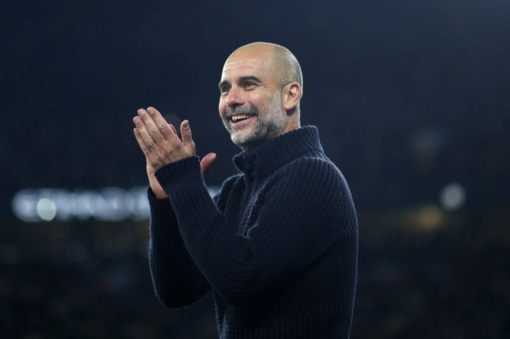 Pep Guardiola, Manager of Manchester City, celebrates team's fourth goal during the Premier League match between Manchester City and Arsenal FC at Etihad Stadium