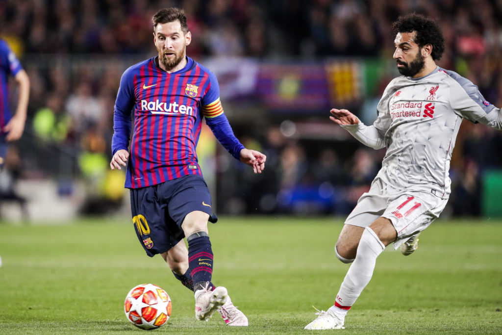 Lionel Messi of FC Barcelona and Mohamed Salah of Liverpool FC during a UEFA Champions League match