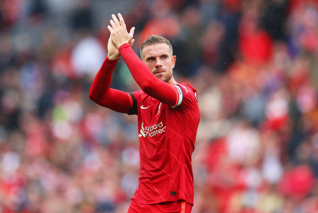 Jordan Henderson applauds fans at Anfield during the Premier League match against Burnley