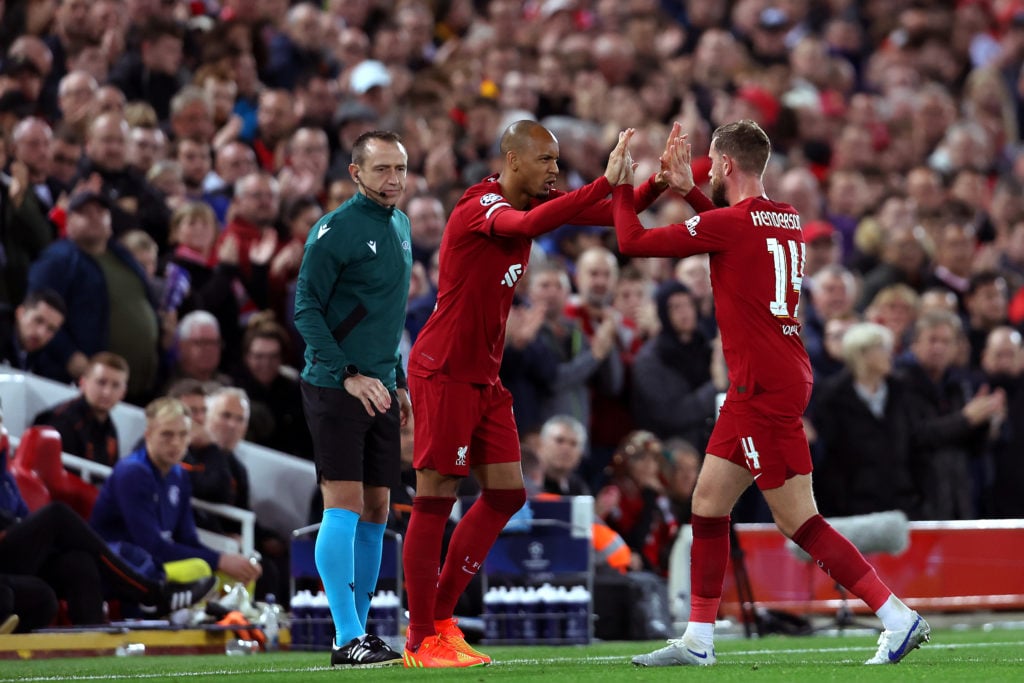 Fabinho replaces Jordan Henderson during Liverpool's UEFA Champions League match against Real Madrid at Anfield.
