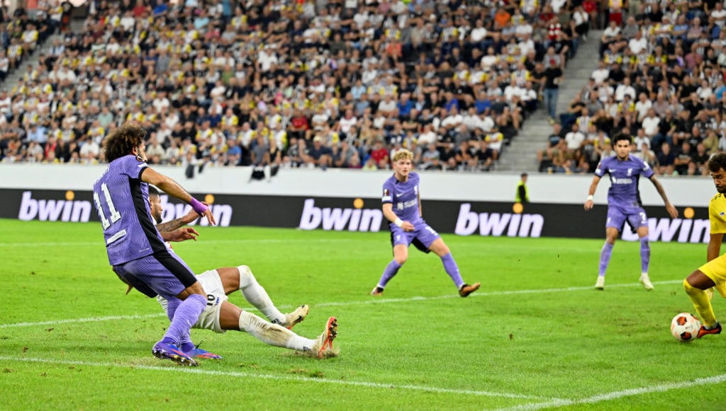 Liverpool forward Mohamed Salah scoring in UEFA Europa League against LASK