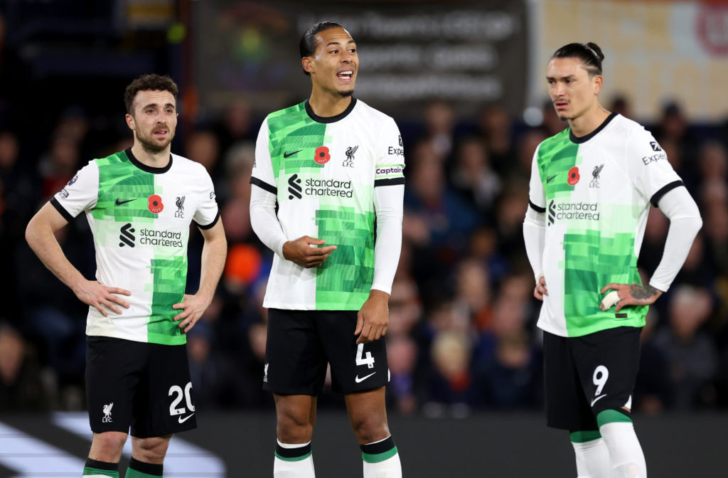 Virgil van Dijk and Diogo Jota pictured in a Premier League game playing for Liverpool.