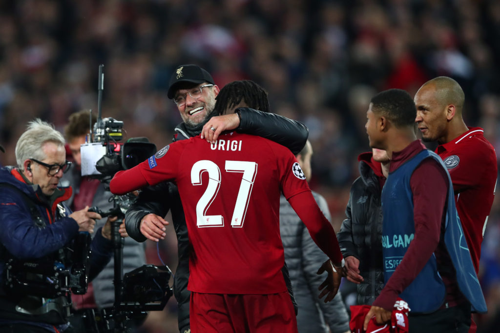 Divock Origi and Jurgen Klopp picture hugging after their Champions League semi-final against Barcelona.