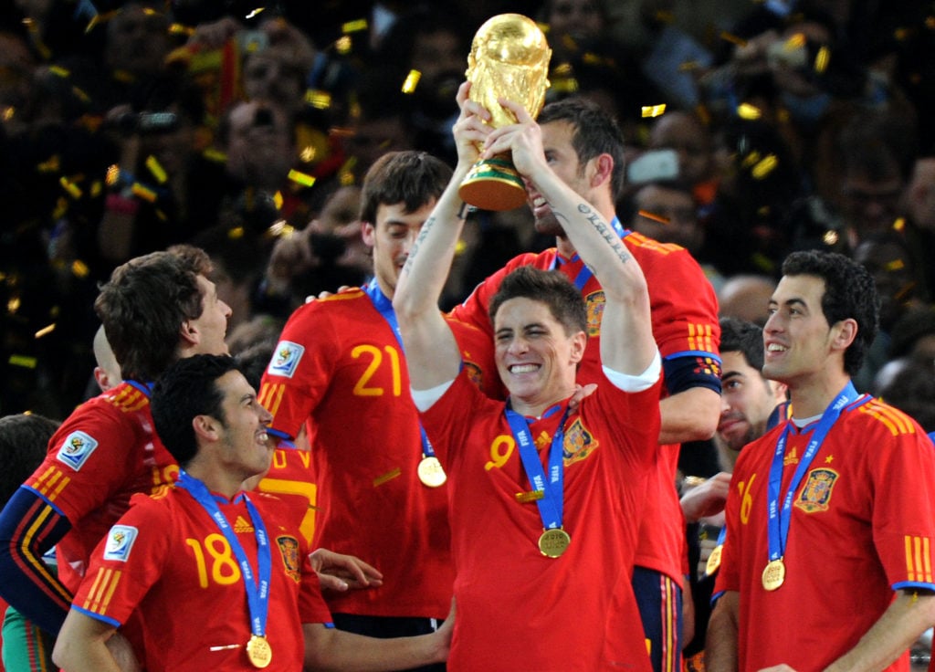 Spain's striker Fernando Torres raises t