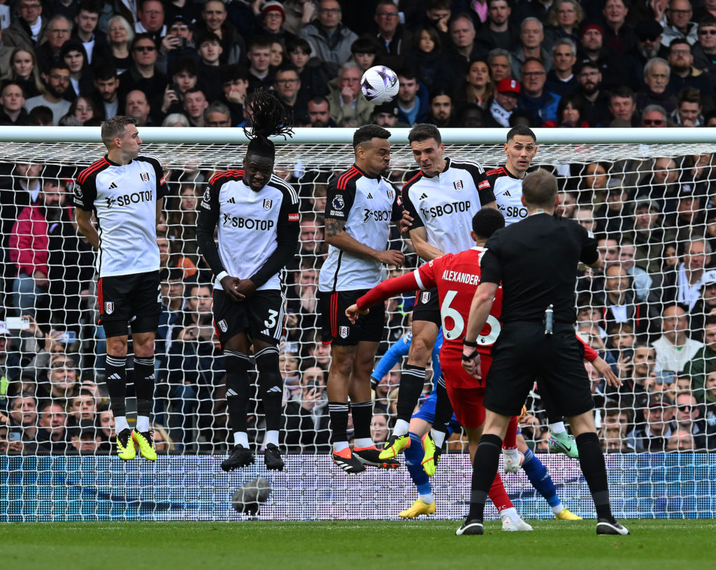 Trent Alexander-Arnold of Liverpool scores the opening goal during the Premier League match between Fulham FC and Liverpool FC at Craven Cottage on April 21, 2024 in London, England.