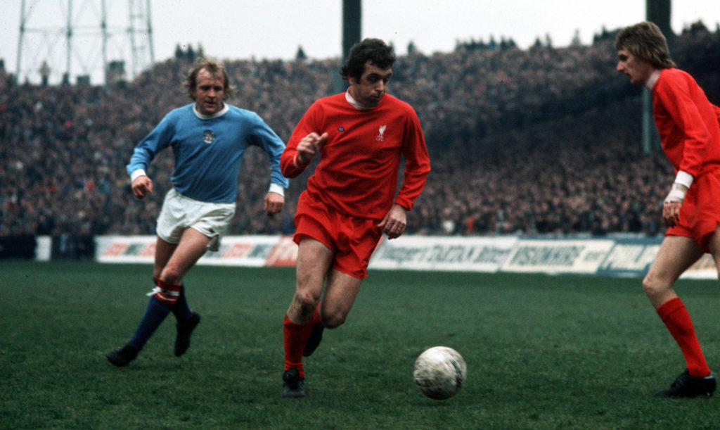 12th April 1974. Maine Road, Manchester. Manchester City v Liverpool. Liverpool's Ian Callaghan moves away from Manchester City's Francis Lee.