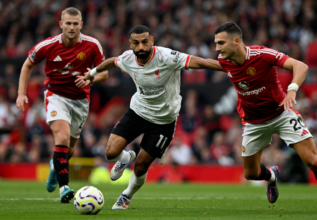 Mohamed Salah runs with the ball against Manchester United during the Premier League match with Liverpool at Old Trafford