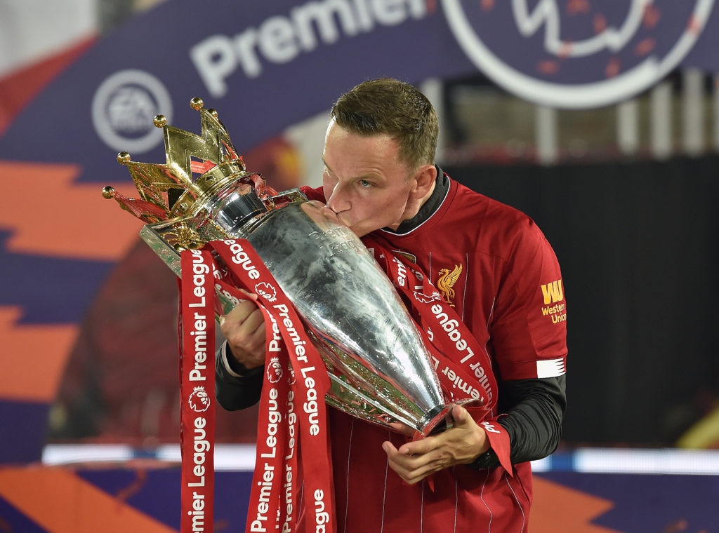 Pep Lijnders kisses the Premier League trophy at Anfield after winning it with Liverpool