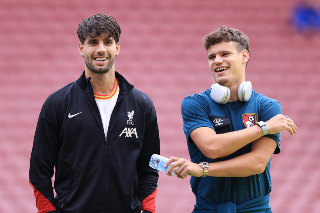 Dominik Szoboszlai of Liverpool chats to Bournemouth's Milos Kerkez ahead of the Premier League match between the teams at Vitality Stadium.