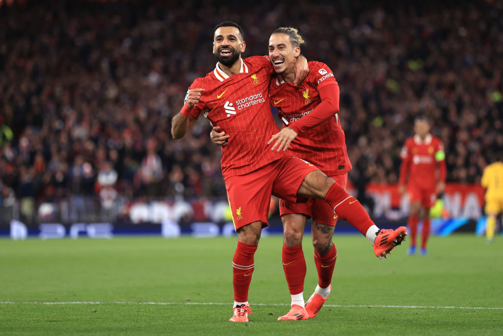 Mohamed Salah of Liverpool celebrates the second goal with Kostas Tsimikas during the UEFA Champions League 2024/25 League Phase MD2 match between Liverpool FC and Bologna FC 1909 at Anfield