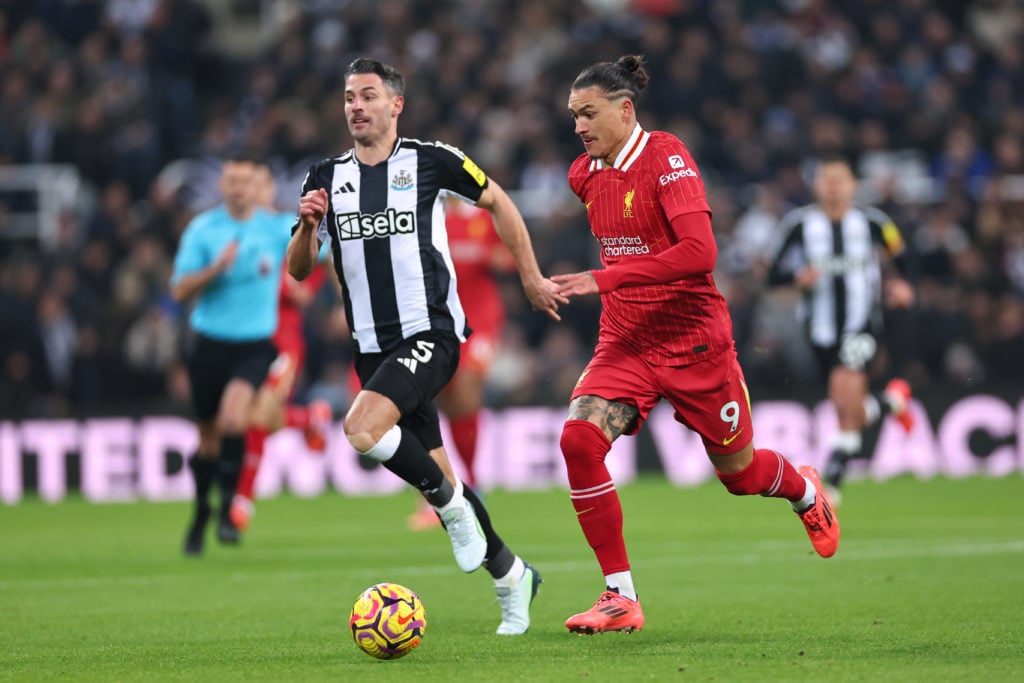 Darwin Nunez running with the ball during Liverpool's Premier League match against Newcastle United at St James' Park.