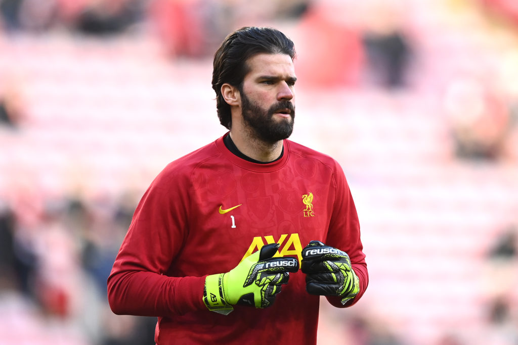Alisson Becker warms up before Liverpool play Ipswich in the Premier League at Anfield