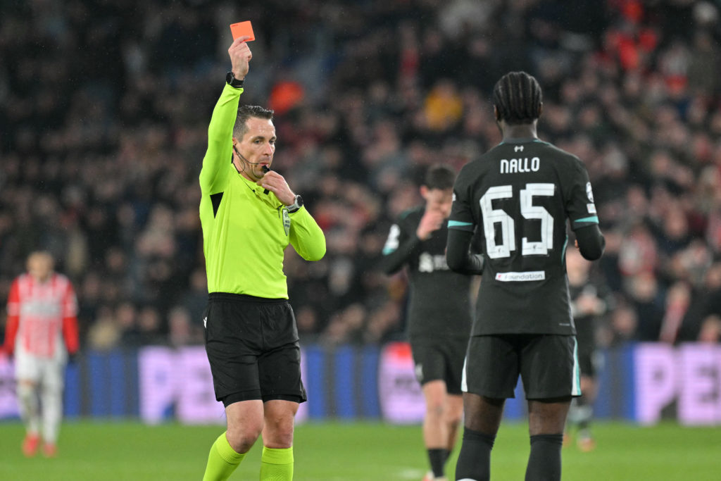 German referee Tobias Stieler (L) shows Liverpool's English defender #65 Amara Nallo (R) a red card as he sends him off for a foul on PSV Eindhoven's Belgian forward #11 Johan Bakayoko