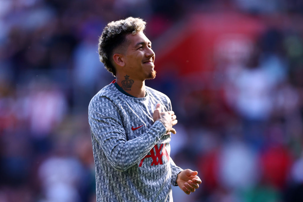 Roberto Firmino pictured warming up for Liverpool ahead of a Premier League game.