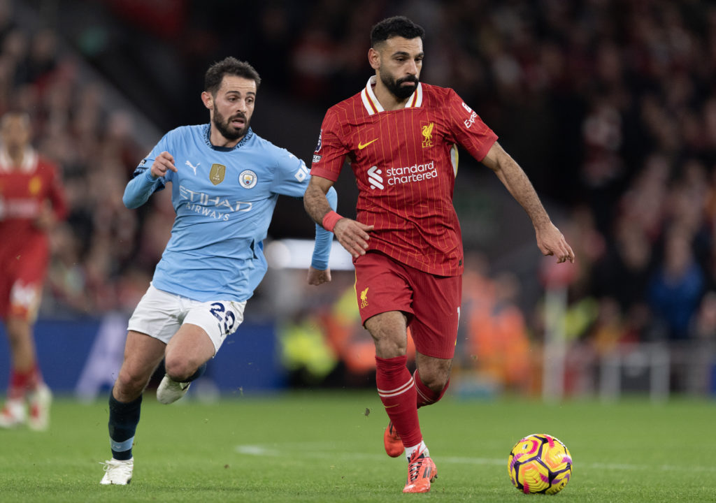 Mohamed Salah of Liverpool and Bernardo Silva of Manchester City in action during the Premier League match between Liverpool FC and Manchester City FC at Anfield
