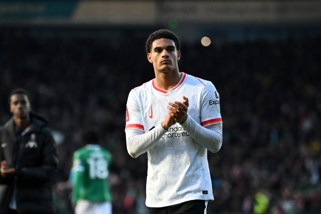 Jarell Quansah applauds fans after Liverpool lose in the FA Cup against Plymouth Argyle at Home Park.