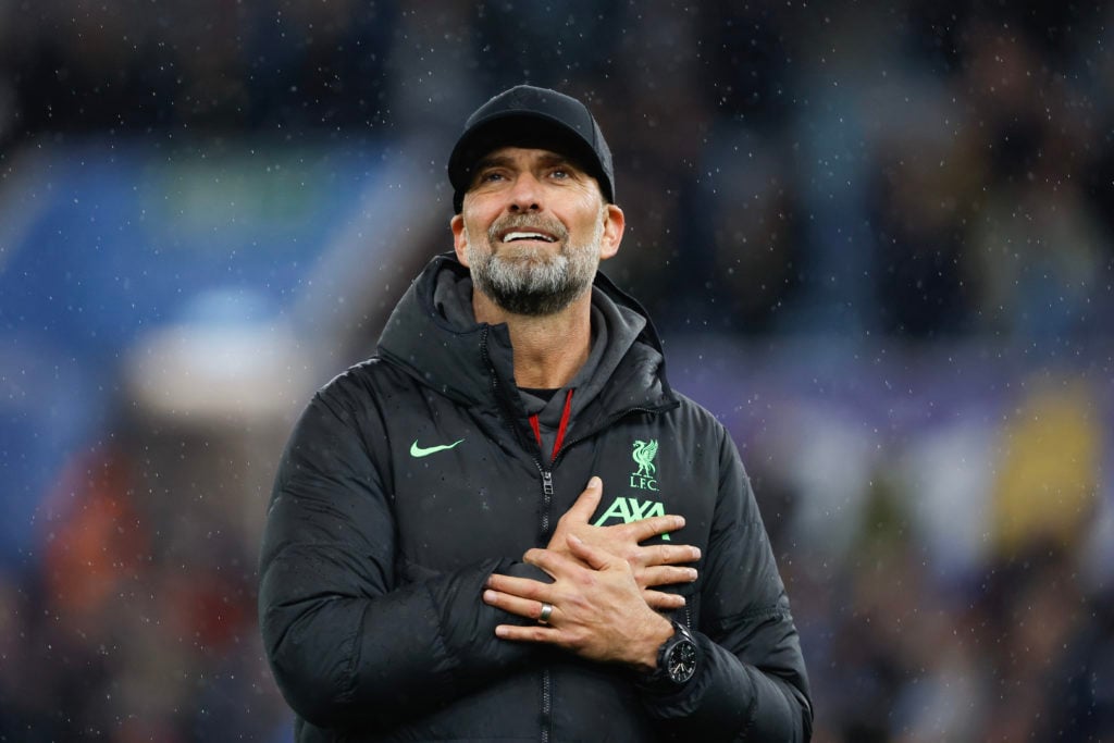 Jurgen Klopp gestures to the Liverpool fans after his final away match in charge against Aston Villa