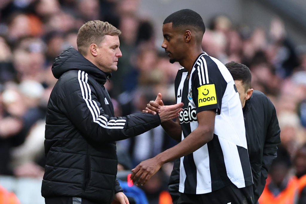 Eddie Howe shakes hands with Alexander Isak after substituting him during Newcastle United's Premier League match against Nottingham Forest at St James' Park.