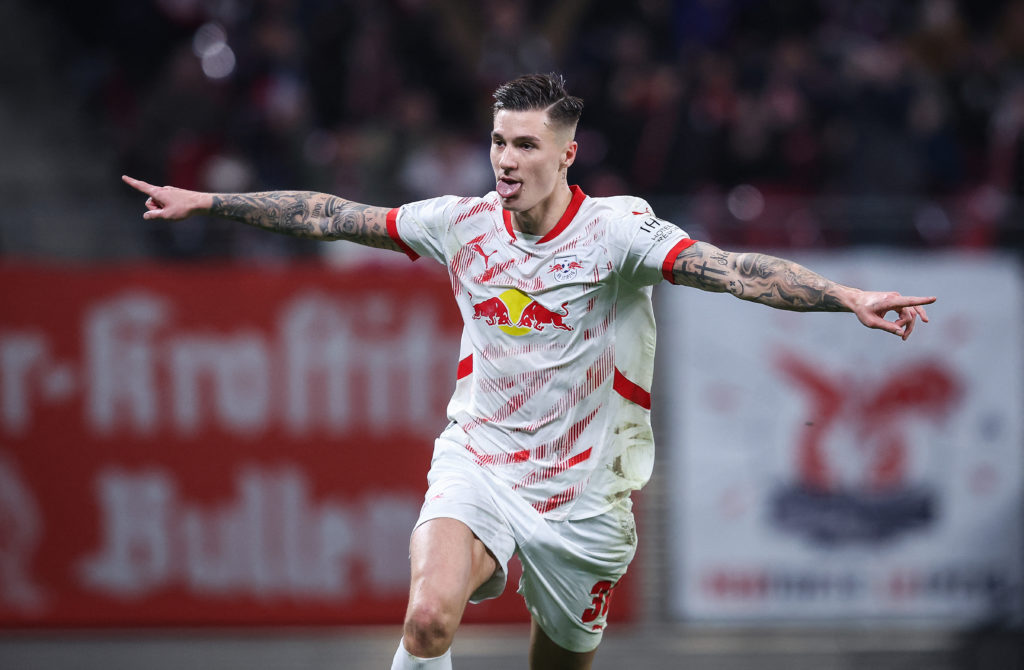 Benjamin Sesko celebrates scoring for RB Leipzig against Vfl Wolfsburg in the Bundesliga