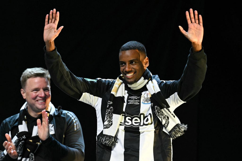 Alexander Isak waves to the crowds at Newcastle United's Carabao Cup winners parade.