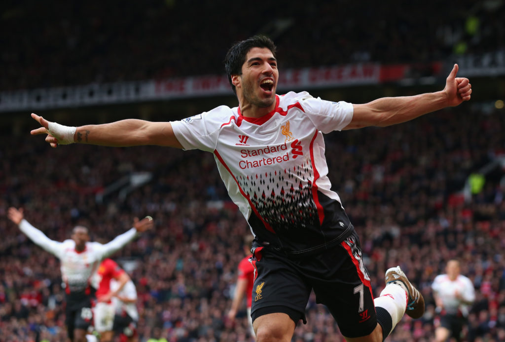 Luis Suarez of Liverpool celebrates scoring his team's third goal during the Barclays Premier League match between Manchester United and Liverpool at Old Trafford