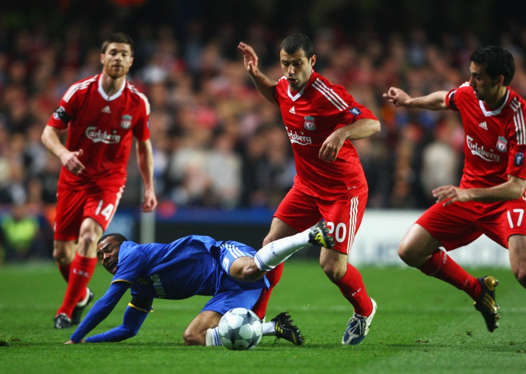 Javier Mascherano challenges Ashley Cole for the ball during Liverpool's Premier League match against Chelsea at Stamford Bridge.