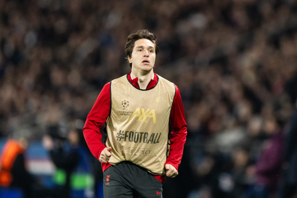 Federico Chiesa warms up during Liverpool's UEFA Champions League match against Paris Saint Germain at Parc des Princes.