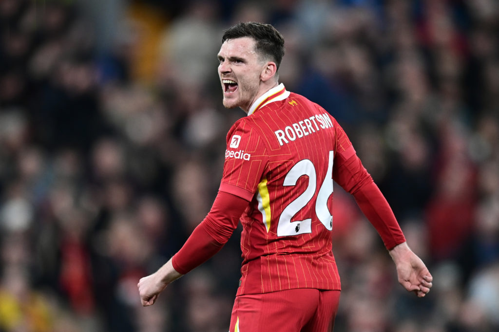 Andy Robertson pictured shouting at his teammates during the Premier League clash between Liverpool and Everton.