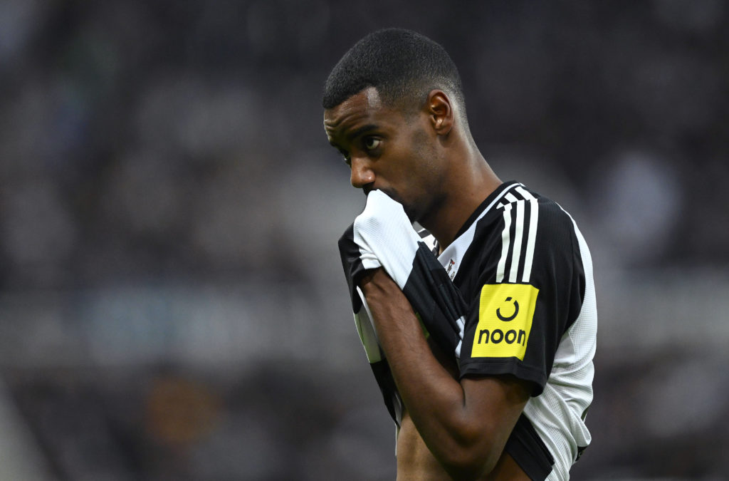 Alexander Isak wipes his face with his shirt during Newcastle United's Premier League match against Crystal Palace at St James' Park.